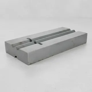 Manganese steel blow bars stacked in warehouse